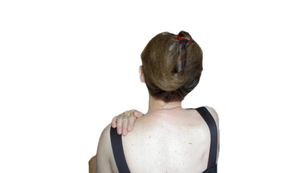 self massage woman massaging shoulder tulemus A woman is massaging her shoulder