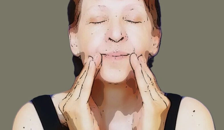 Face Massage: Woman Massages the Corners of Her Mouth